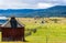 Red Barn With Mountains In The Distance