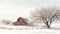 Red barn in a snow covered field