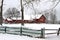 Red barn on a snowy morning