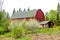 Red Barn with Spring Blooming Trees in Front