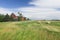 Red barn stands by a field in Idaho