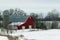 A Red Barn Under Winter Skies