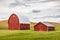 Red barns in wheat fields in the Palouse hills