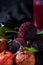 red bayberry(waxberry) and lychee placed together on marble tabletop, dark indoor background