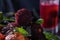 red bayberry(waxberry) and lychee placed together on marble tabletop, dark indoor background