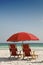 Red Beach Chairs and Umbrella