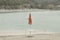 red beach umbrella on the shore of Fiastra Lake