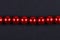 Red beads on a black