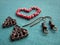 Red beads in form of heart, making earrings, handmade jewelry