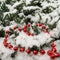 Red beads in shape of a heart with snow