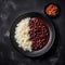 Red Beans And Rice On Black Smooth Round Plate U.S. Dish. Generative AI