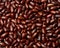 Red beans scattered across the field frame. Background. Close quarters. Top view
