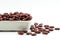 Red beans in white ceramic vessels and placed on a white background