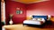 Red bedroom with a blue headboard, and nightstands