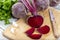 Red beetroot with herbage green leaves on wooden background