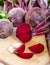 Red beetroot with herbage green leaves on wooden background