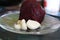 Red beets and garlic cloves on a plate