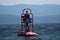 Red bell buoy in inside passage Canada