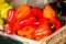 Red bell pepper with a bright pattern beautiful pattern in bulk in a drawer. Vegetables, healthy foods