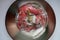 Red bell pepper covered with mold on a glass plate