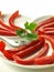 Red bell pepper slices, closeup, isolated