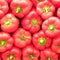 Red bell peppers top view closeup, seamless natural background