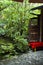 Red Bench in front of green foliage