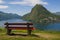 Red bench on the observation point in the Parco San Michele in the foreground.