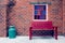 Red bench and windows on brick wall,filter effect