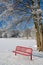 Red bench in winter scenery