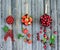 Red berries in copper pots on rustic weathered wooden background. Summer gifts and harvest concept. Collage of different berries.