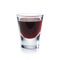 Red berries liqueur is the shot glass isolated on white.