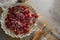 Red berries on tart with whisker and rolling pin
