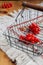 Red berries of viburnum in wire basket