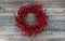 Red Berry Holiday Wreath on Wood