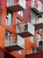 Red bicycle stored on balcony. Detail of contemporary building, Vancouver, BC, Canada.