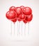 Red birthday balloons soaring in air