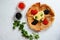 Red and black caviar and pancakes on a white background