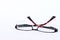 Red - black dioptric glasses on a clean white background.