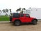 Red and black Jeep Wrangler parked on a street of one beach of Lima