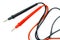 Red and black multimeter probes on a white background