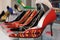 Red, black and others spike heel on glasses shelf