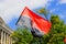 Red black patriotic Ukrainian flag with the inscription in Ukrainian - Right Sector and coat of arms of Ukraine waving. National