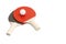 Red and black ping pong paddles with a white ball