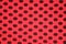 Red with black spots textile texture