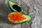 Red and black vegan caviar from kelp seaweed on avocado halves. Valuable product for a healthy diet. Superfood