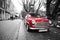 Red black and white classic mini cooper car in holland postcard