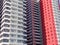 Red, black and white facades of new high-rise residential buildings