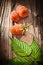 Red blackberries leaf on vintage wooden board