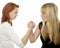 Red and blond haired girls battle each other